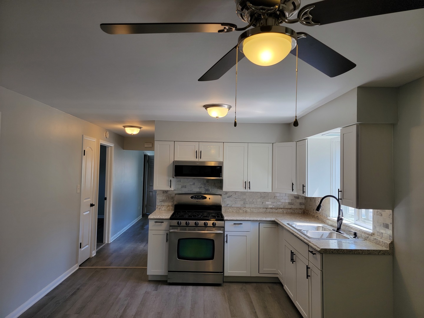 912 State Street, Unit 2 Lemont, IL 60439 - Photo 15 of 25 a kitchen with a sink cabinets and stainless steel appliances