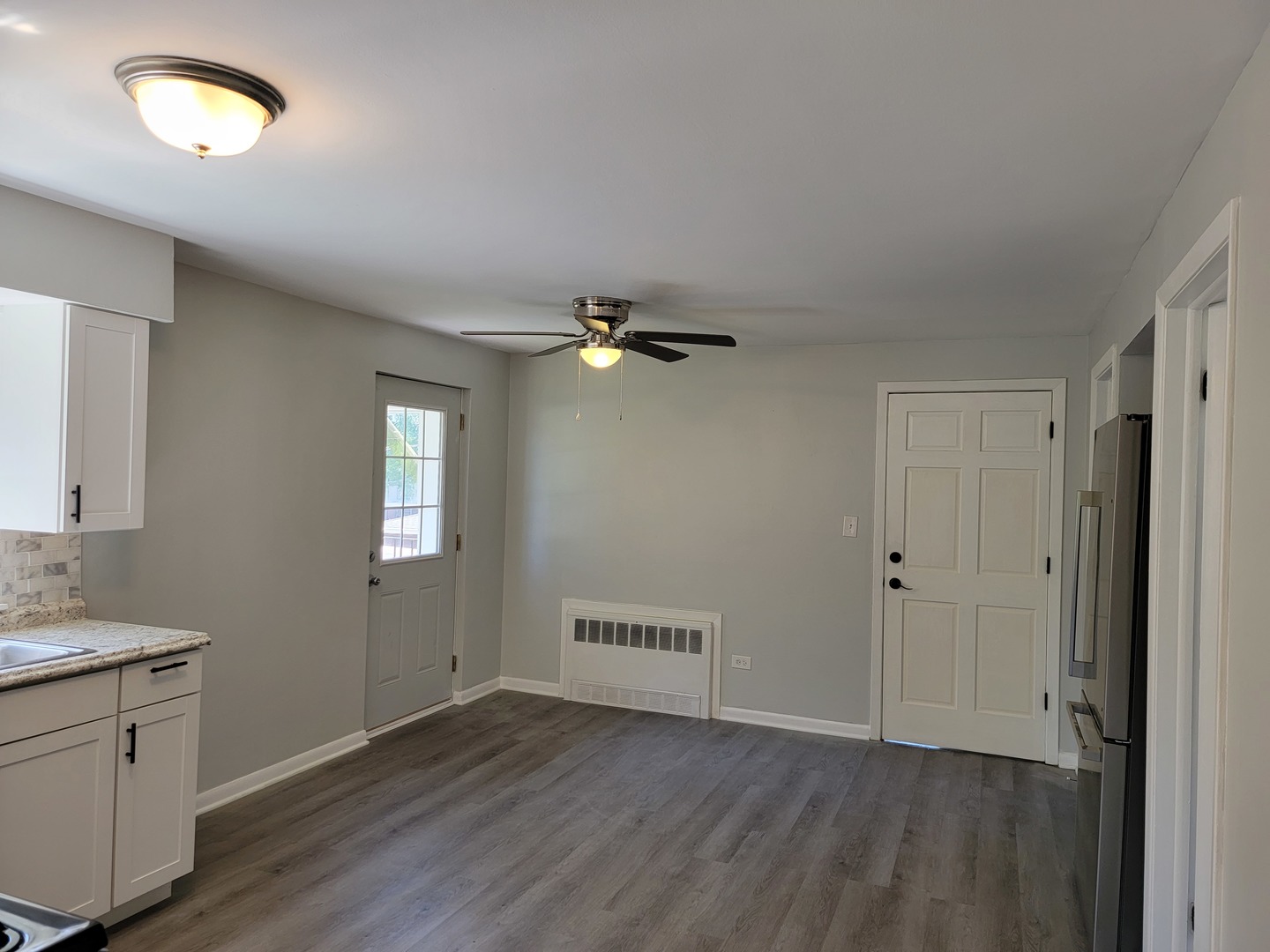 912 State Street, Unit 2 Lemont, IL 60439 - Photo 17 of 25 wooden floor in an empty room with a window