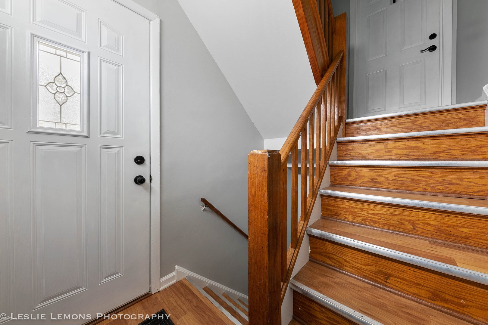 912 State Street, Unit 2 Lemont, IL 60439 - Photo 23 of 25 a view of entryway with wooden floor and stairs