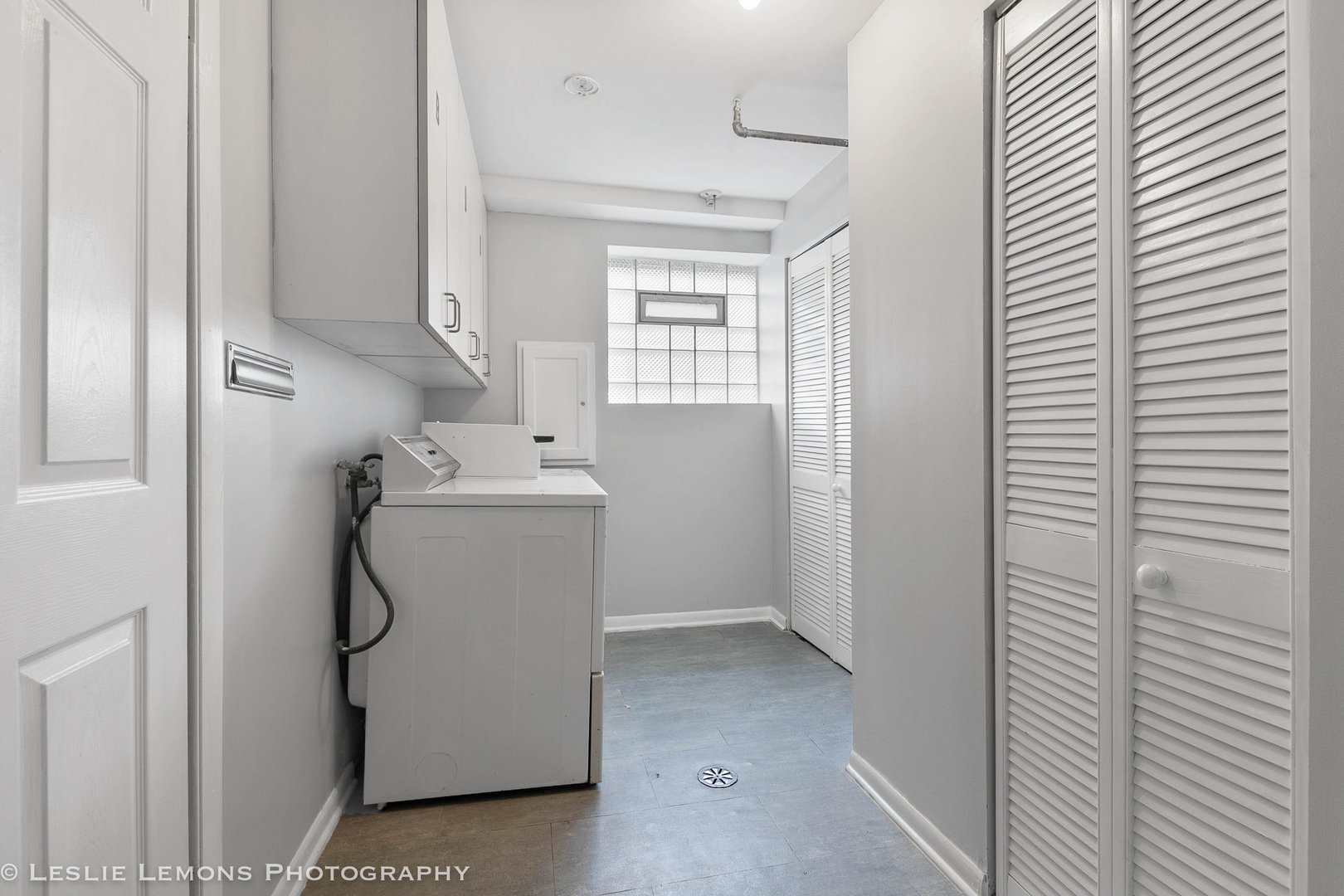 912 State Street, Unit 2 Lemont, IL 60439 - Photo 25 of 25 a utility room with cabinets washer and dryer