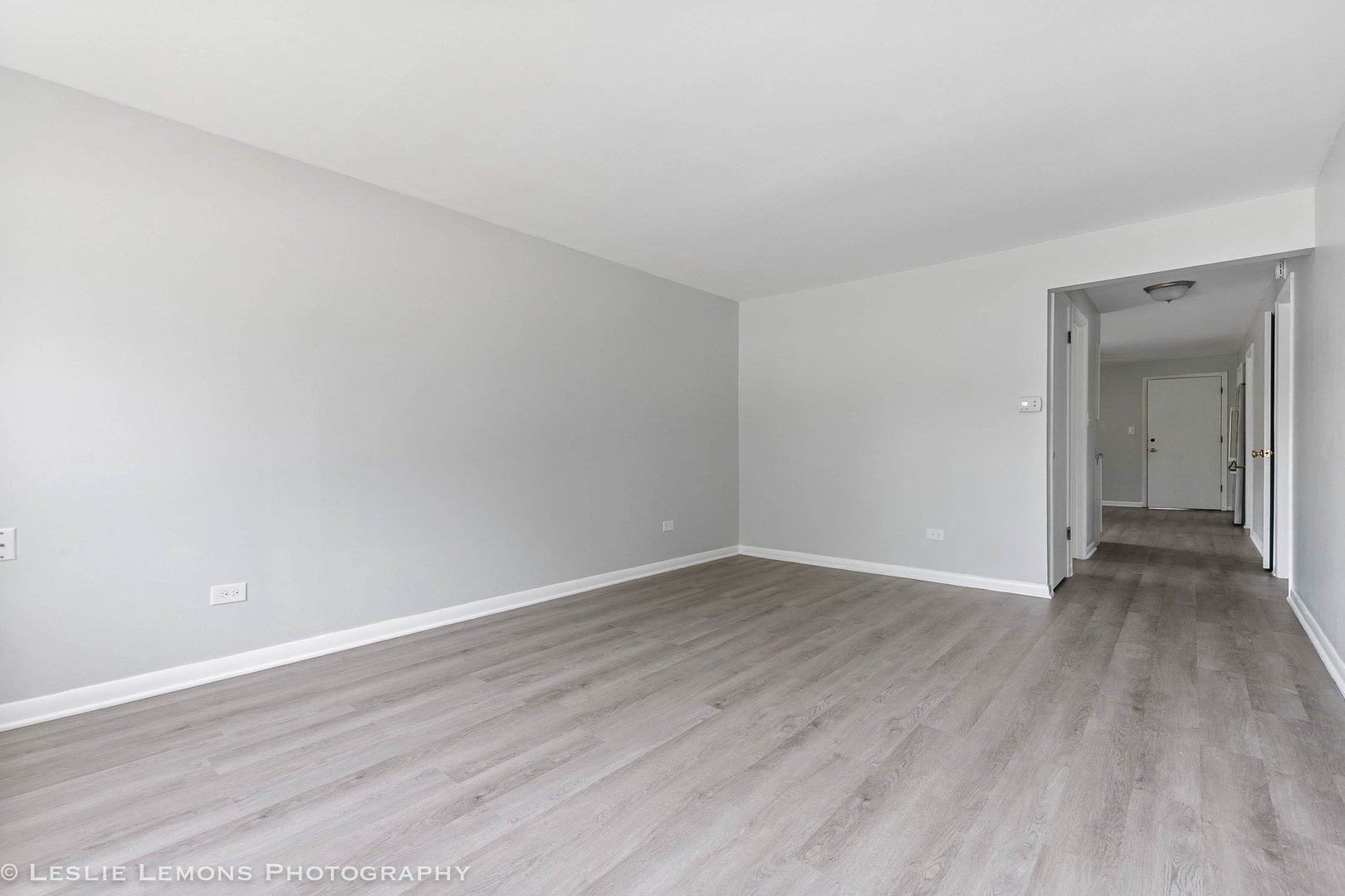 912 State Street, Unit 2 Lemont, IL 60439 - Photo 6 of 25 a view of an empty room with wooden floor and closet