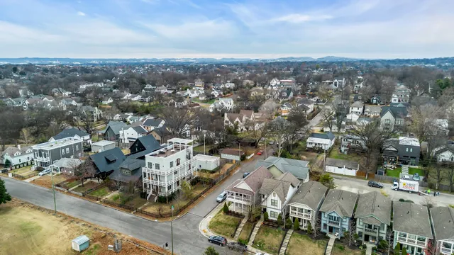 a spacious bedroom with a large bed and windows