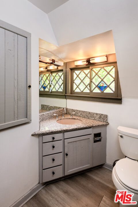1954 Hillcrest Road, Unit 3 Los Angeles, CA 90068 - Photo 22 of 26 a bathroom with a toilet sink and window