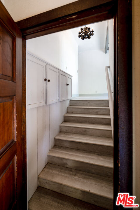 1954 Hillcrest Road, Unit 3 Los Angeles, CA 90068 - Photo 3 of 26 a view of staircase with wooden floor and a window