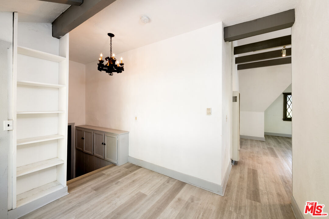 1954 Hillcrest Road, Unit 3 Los Angeles, CA 90068 - Photo 5 of 26 a view of empty room with wooden floor