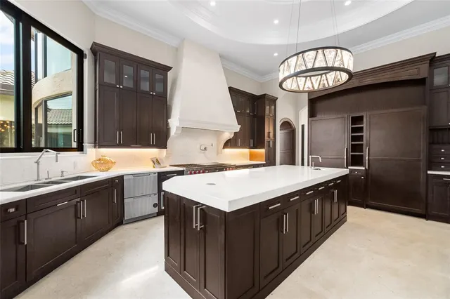 a spacious bedroom with a bed and a ceiling fan