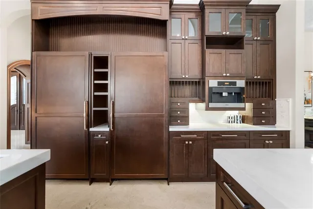 a spacious bedroom with a bed and large window