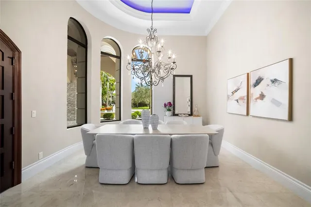 a bathroom with a granite countertop sink mirror vanity and toilet