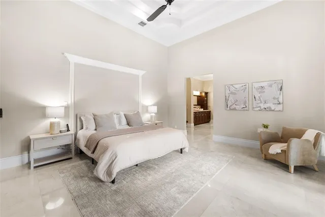 a view of a patio with a table and chairs and potted plants