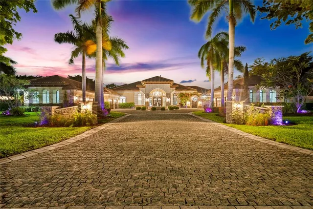 a view of a porch with furniture and a yard