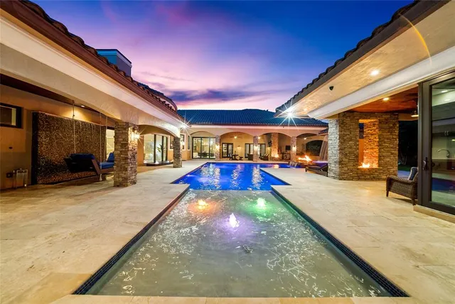 a view of a patio with swimming pool