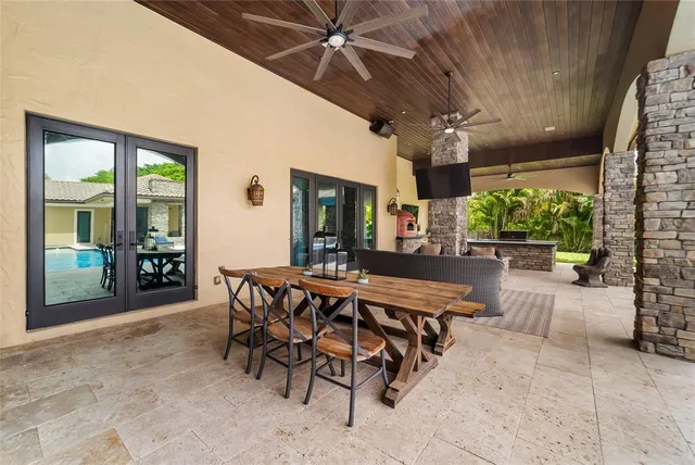 a view of a patio with a table and chairs