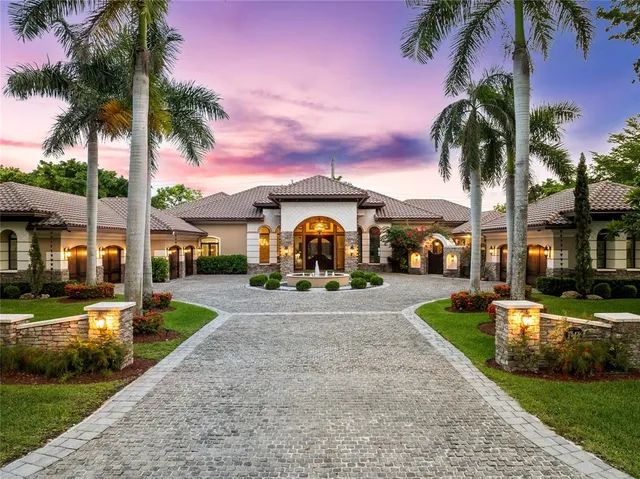 a kitchen with a sink and a refrigerator