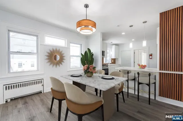 a kitchen with a table and chairs in it