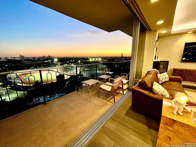 a view of a balcony with furniture