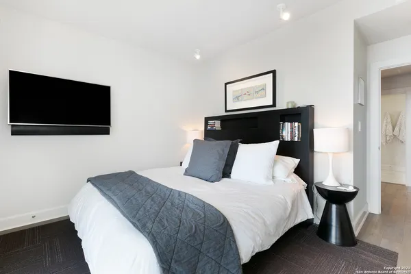 a bathroom with a shower and a sink