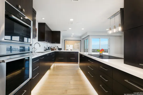 a large kitchen with stainless steel appliances