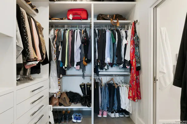 a view of a dining room with furniture and a floor to ceiling window