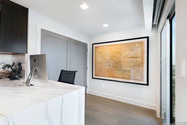 a room with a large window and a bed