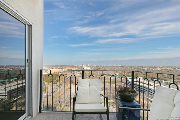 a dining room with furniture window and wooden floor
