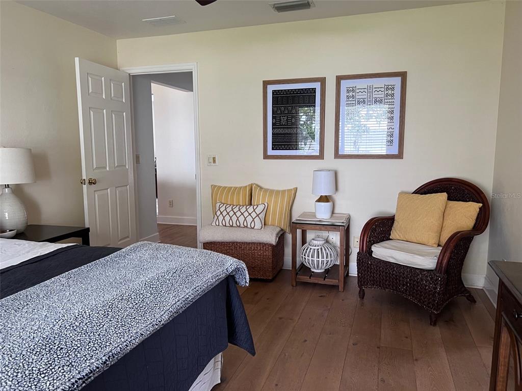 12595 Southeast Sunset Harbor Road Weirsdale, FL 32195 - Photo 15 of 25 a bedroom with a bed and a couch