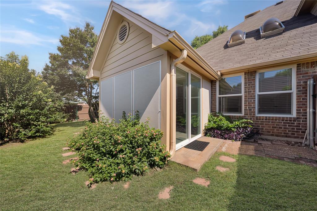 2909 Normandy Court Euless, TX 76039 - Photo 33 of 36 a front view of a house with garden