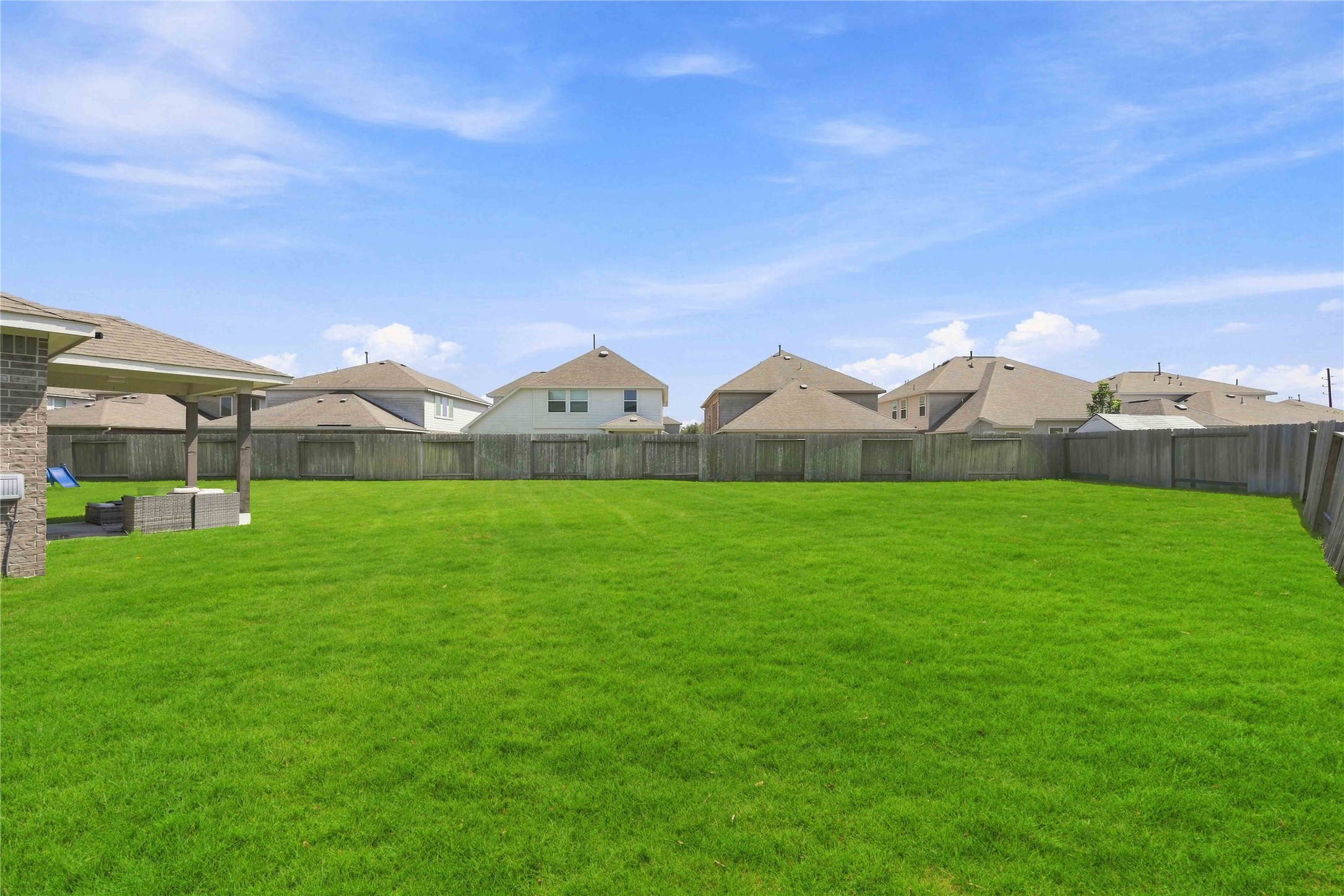 2402 Mount Dana Drive Rosharon, TX 77583 - Photo 26 of 28 Expansive backyard with lush green lawn, perfect for outdoor activities and entertaining.