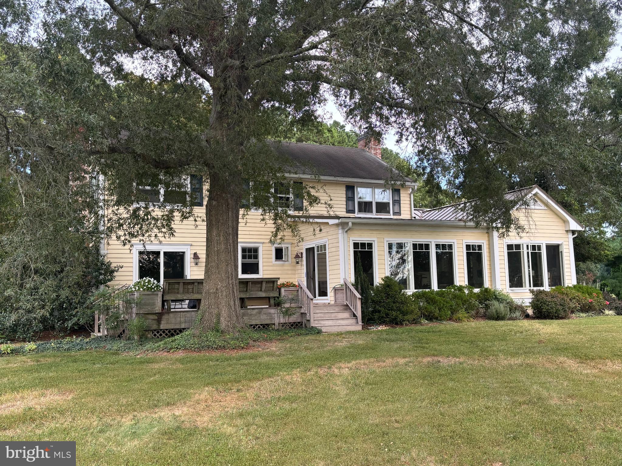 6680 Peachblossom Point Road Easton, MD 21601 - Photo 13 of 35 a front view of house with yard and green space