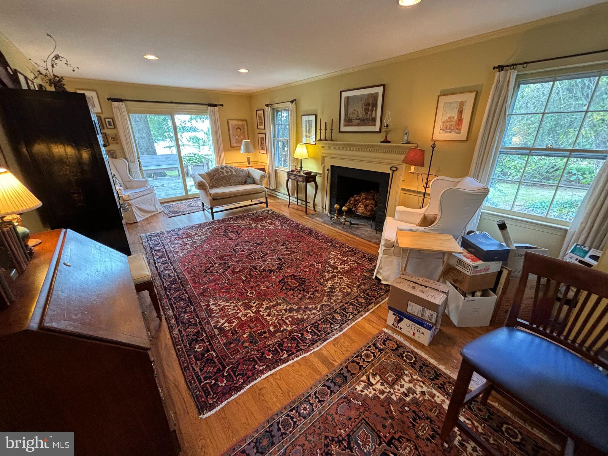 6680 Peachblossom Point Road Easton, MD 21601 - Photo 18 of 35 a living room with furniture rug and window