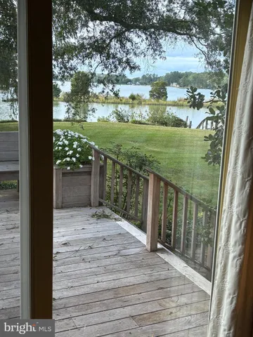 a view of balcony with yard