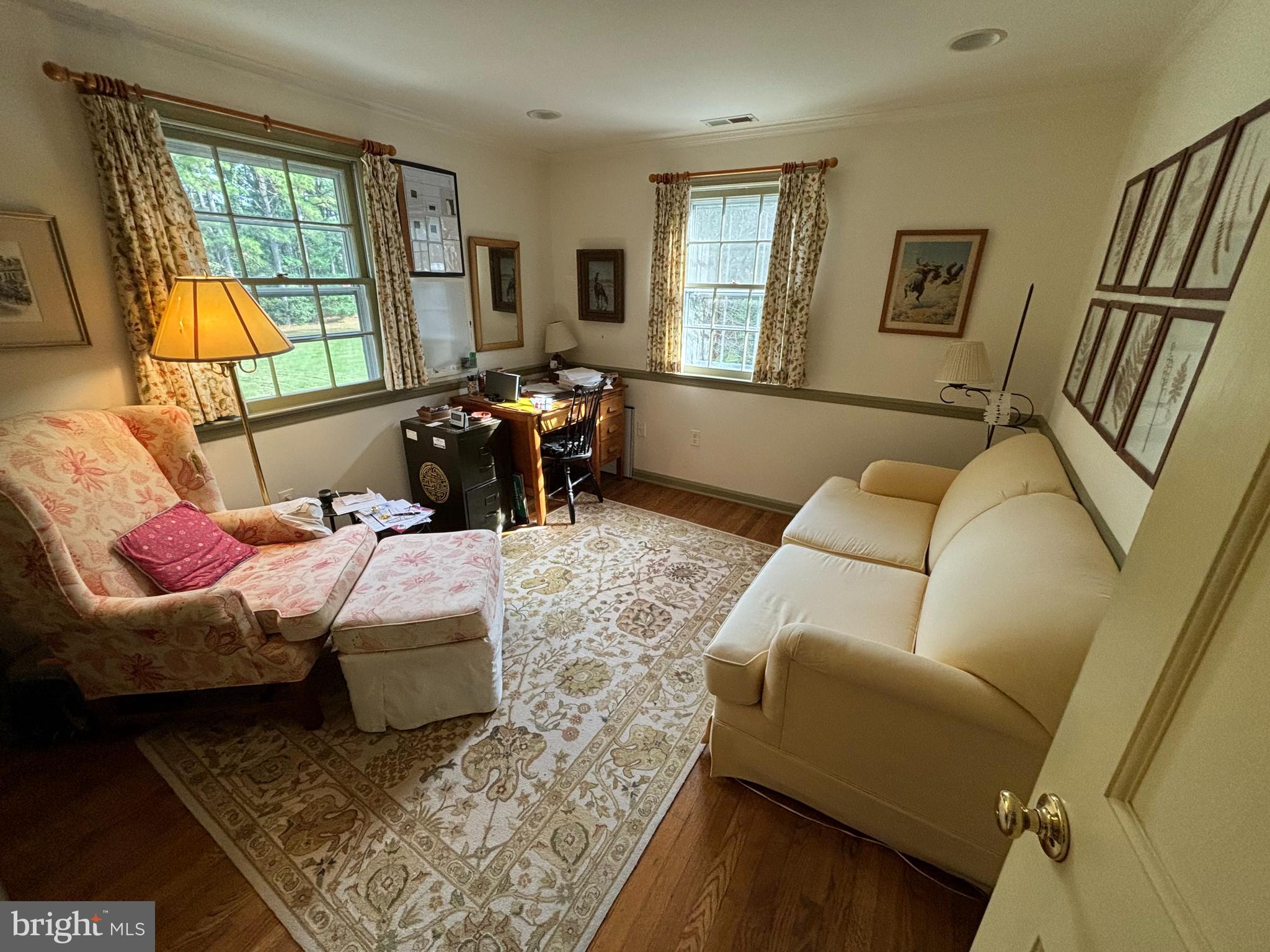 6680 Peachblossom Point Road Easton, MD 21601 - Photo 29 of 35 a bedroom with furniture and a window