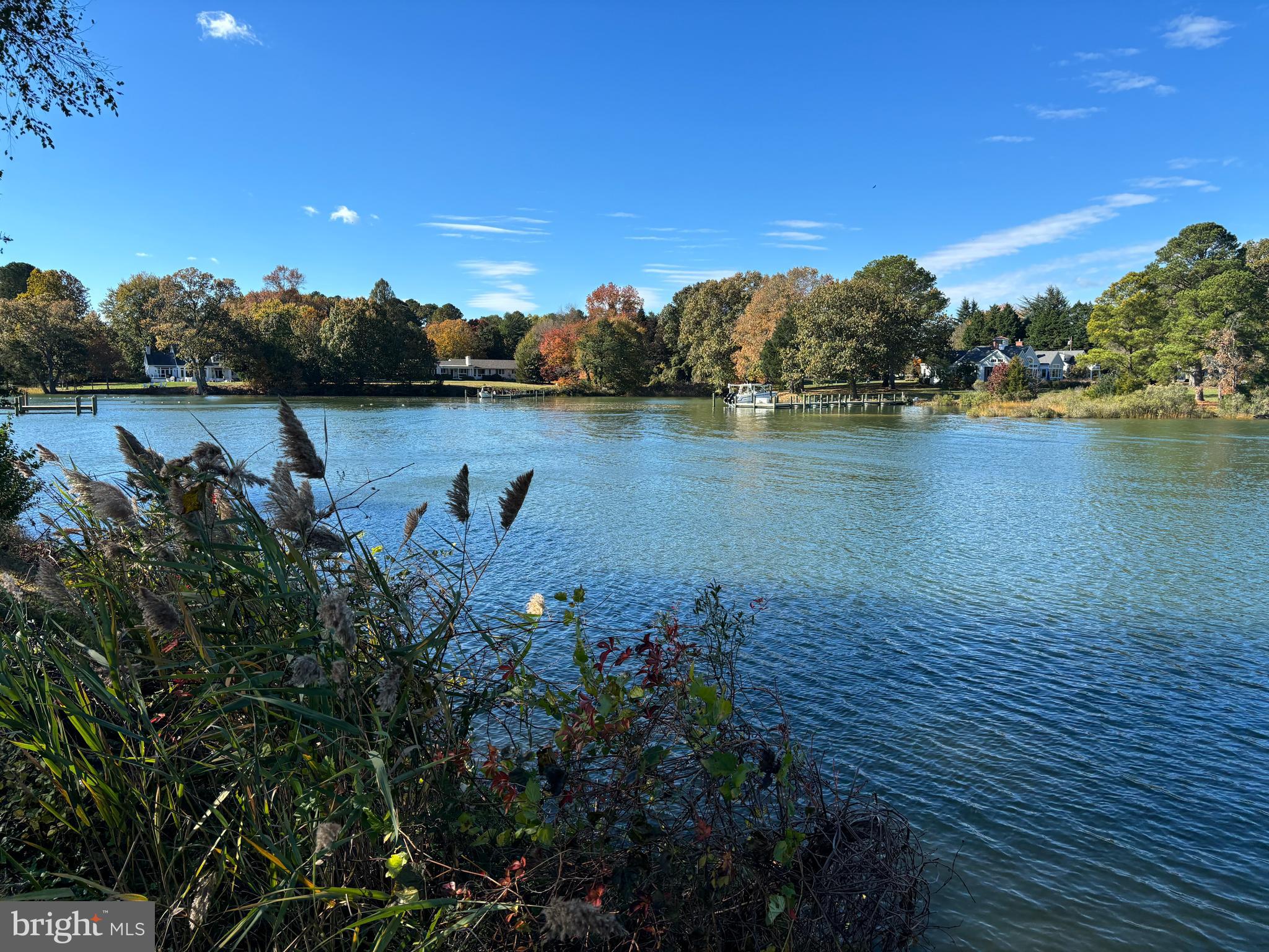6680 Peachblossom Point Road Easton, MD 21601 - Photo 35 of 35 a view of a lake with houses in the back