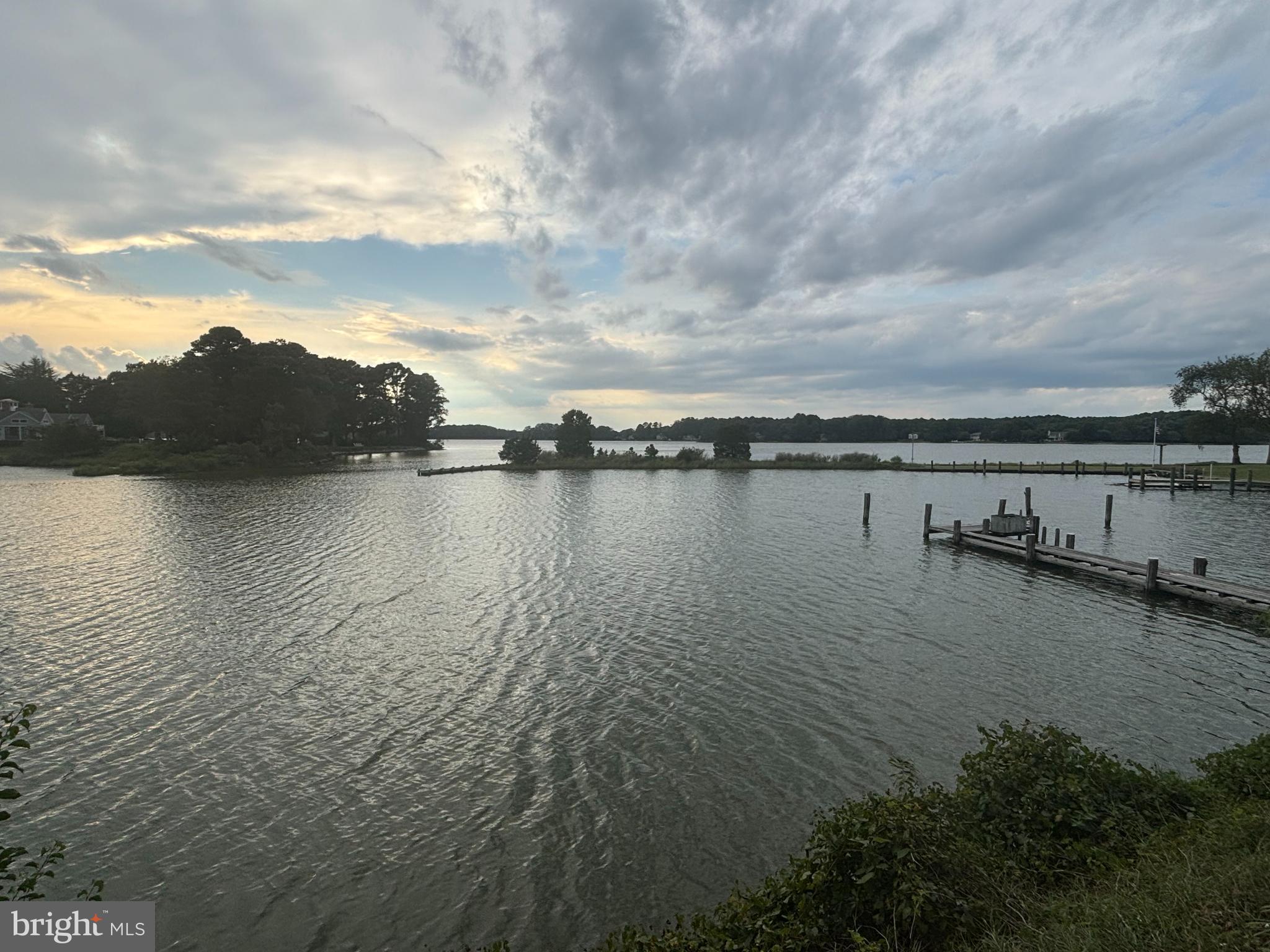 6680 Peachblossom Point Road Easton, MD 21601 - Photo 4 of 35 a view of a lake with houses in back