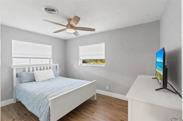 a bedroom with a bed and a desk