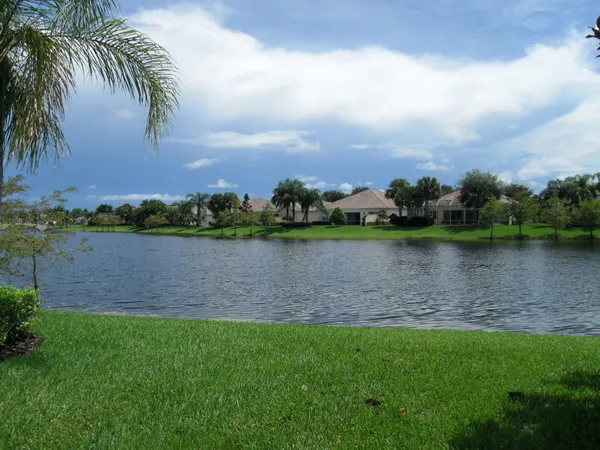 a view of a lake with houses in the back