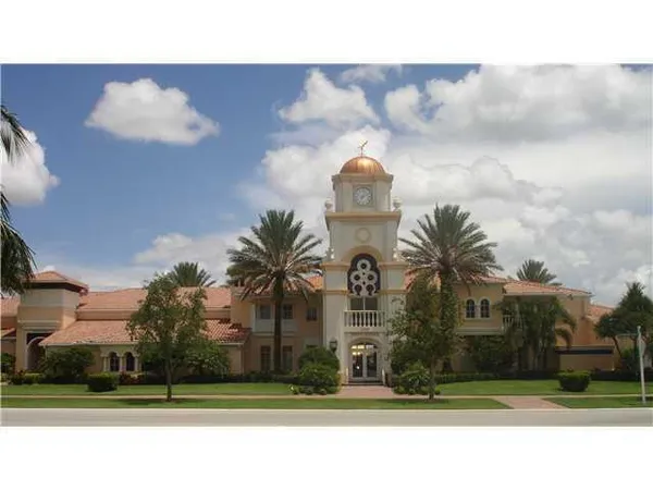 a living room with fireplace furniture and a large window