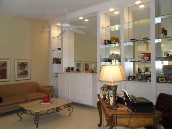 a bathroom with a double vanity sink a mirror and a shower