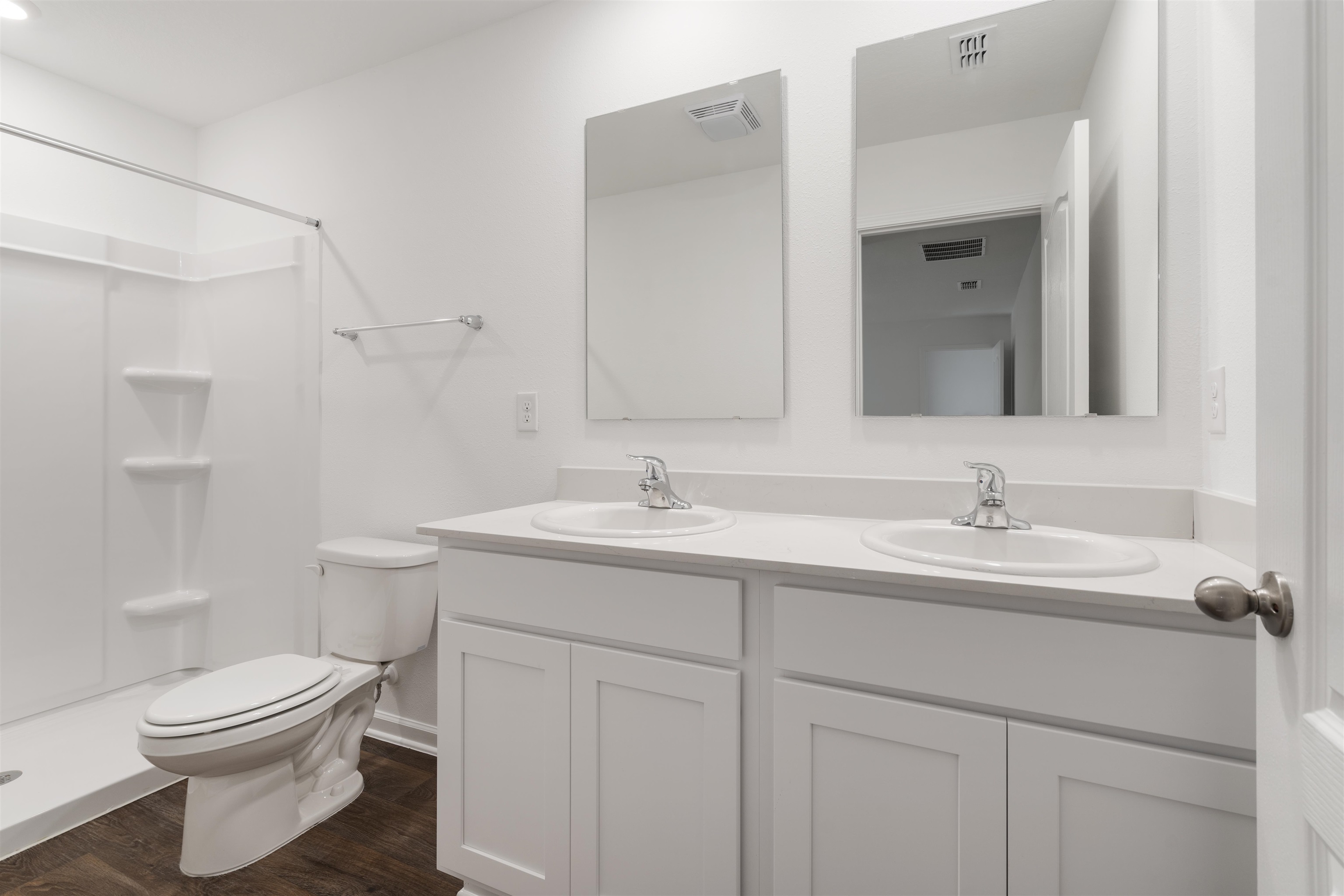 861 Orellana Road St. Augustine, FL 32084 - Photo 11 of 40 a bathroom with a toilet a sink a mirror and vanity