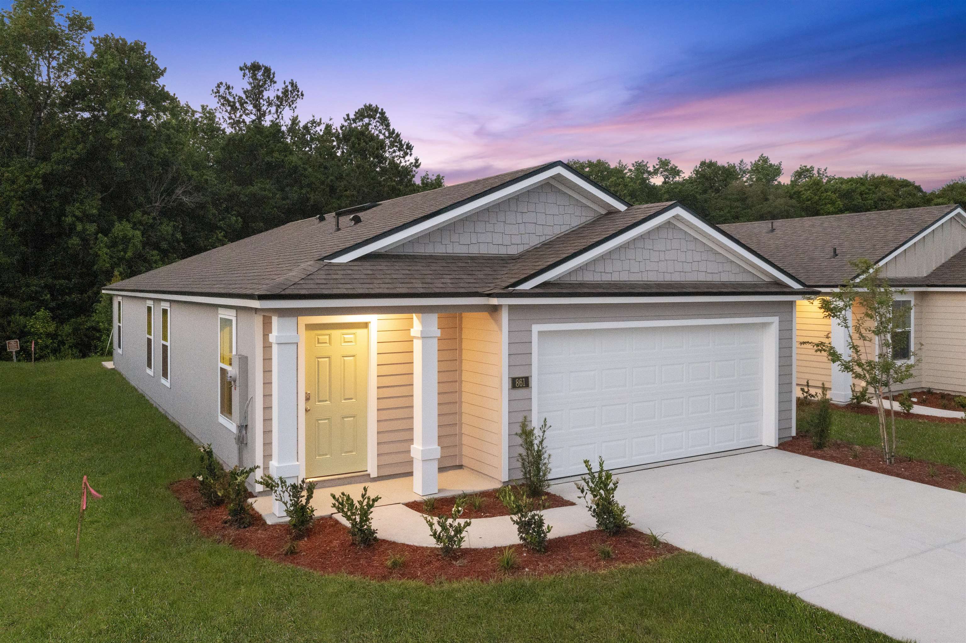 861 Orellana Road St. Augustine, FL 32084 - Photo 21 of 40 a front view of a house with a yard and garage