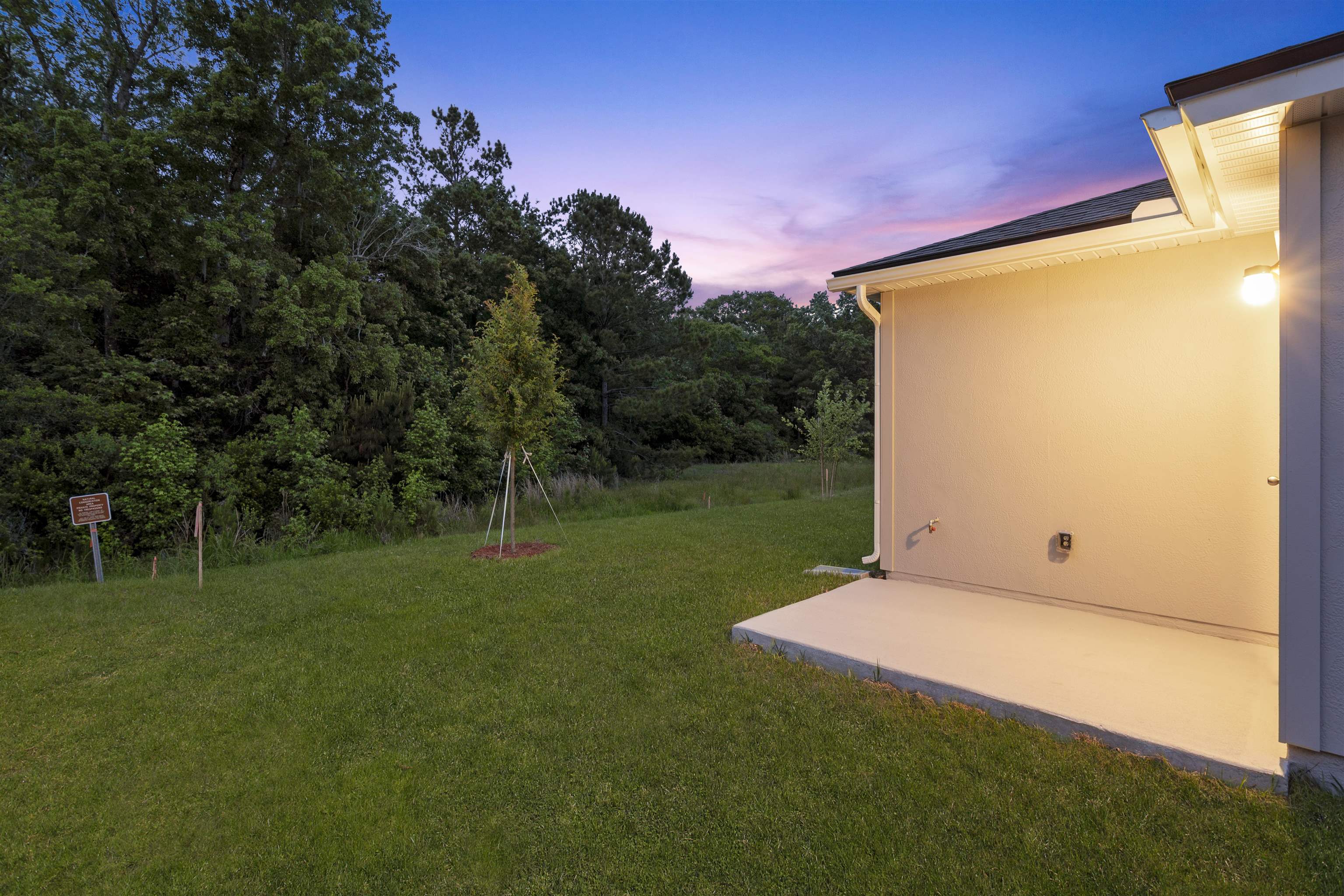 861 Orellana Road St. Augustine, FL 32084 - Photo 25 of 40 a backyard of a house with lots of green space and outdoor seating