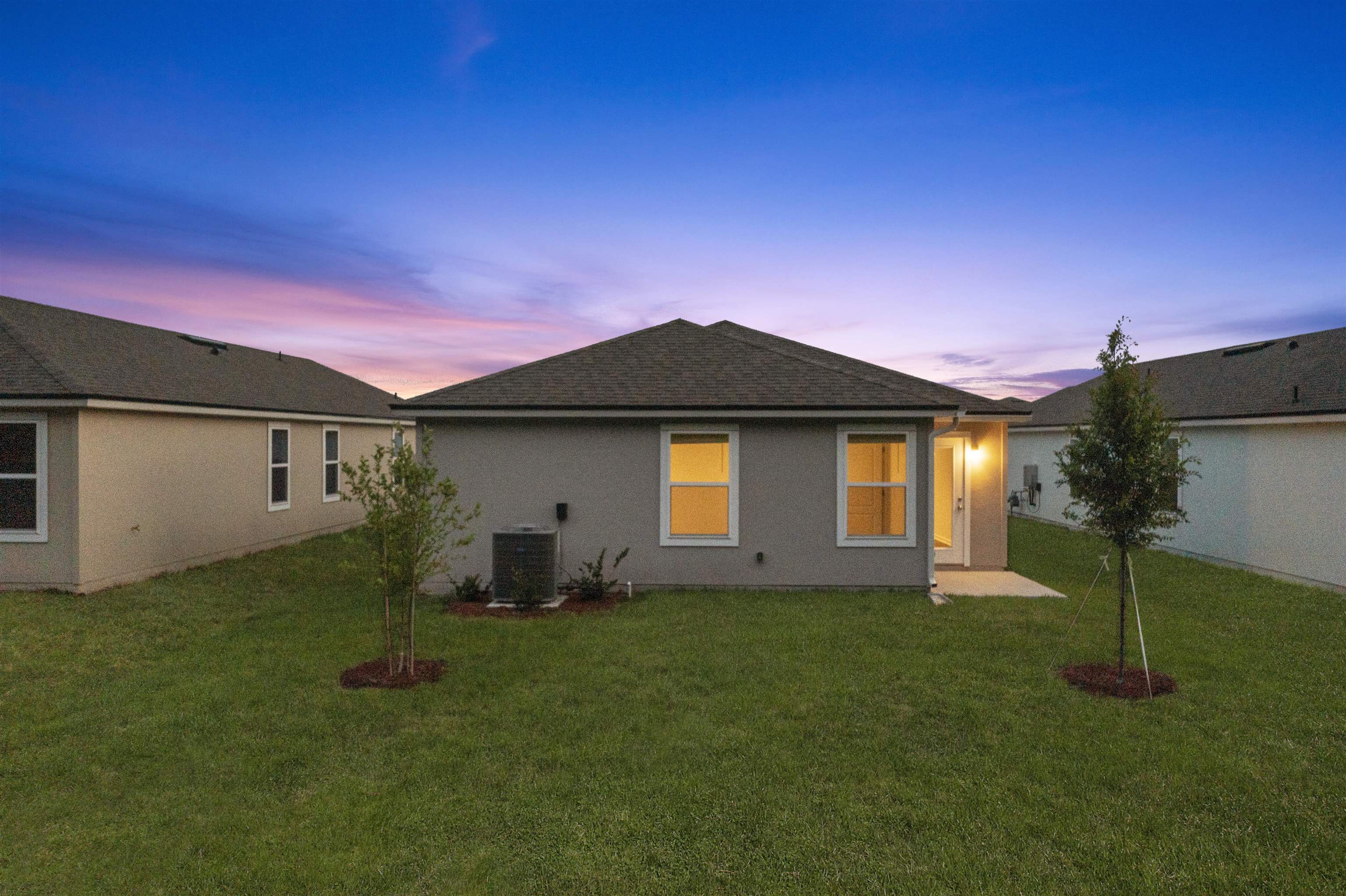 861 Orellana Road St. Augustine, FL 32084 - Photo 27 of 40 a front view of a house with a garden and yard