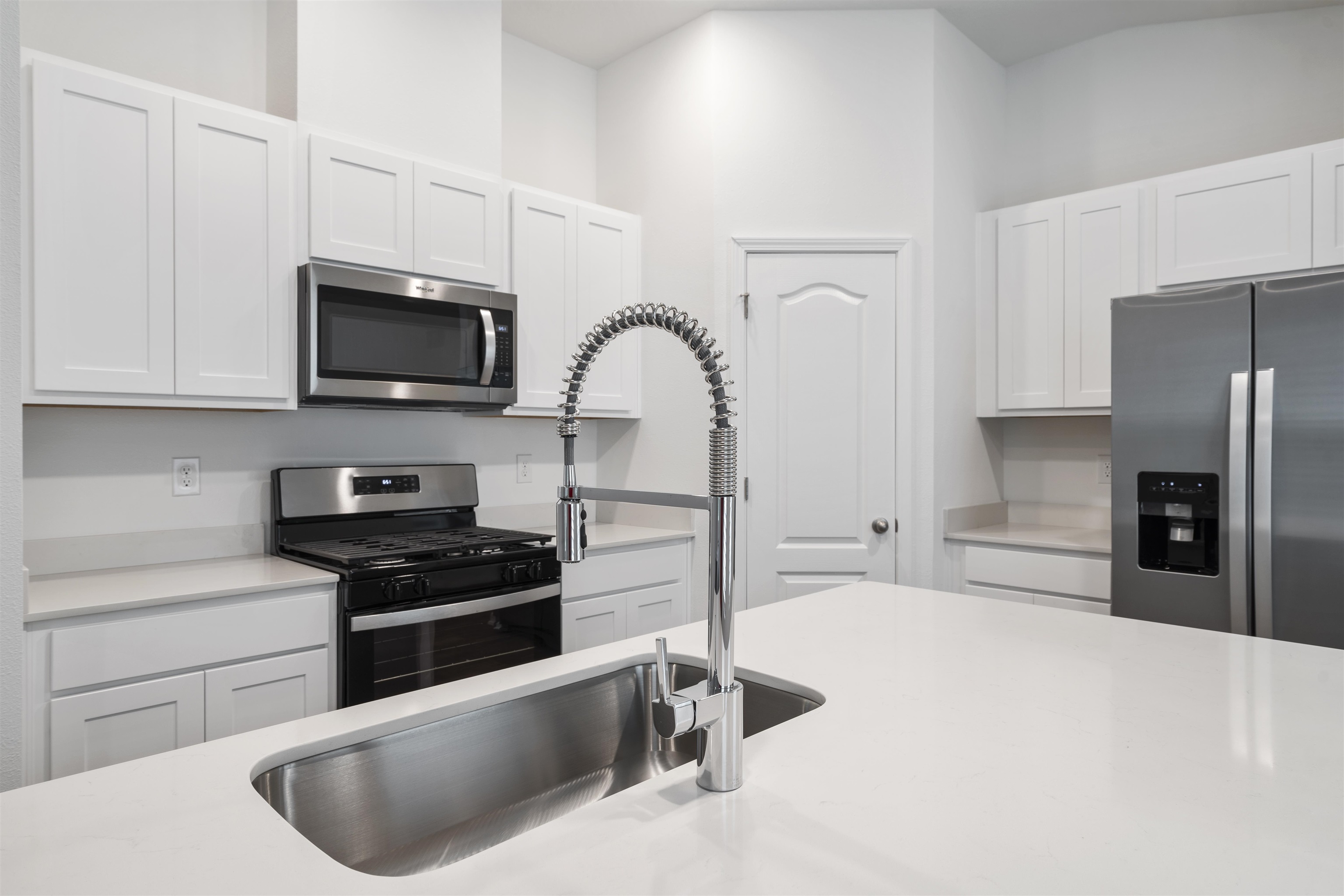 861 Orellana Road St. Augustine, FL 32084 - Photo 6 of 40 a kitchen with stainless steel appliances a stove a sink a microwave and refrigerator