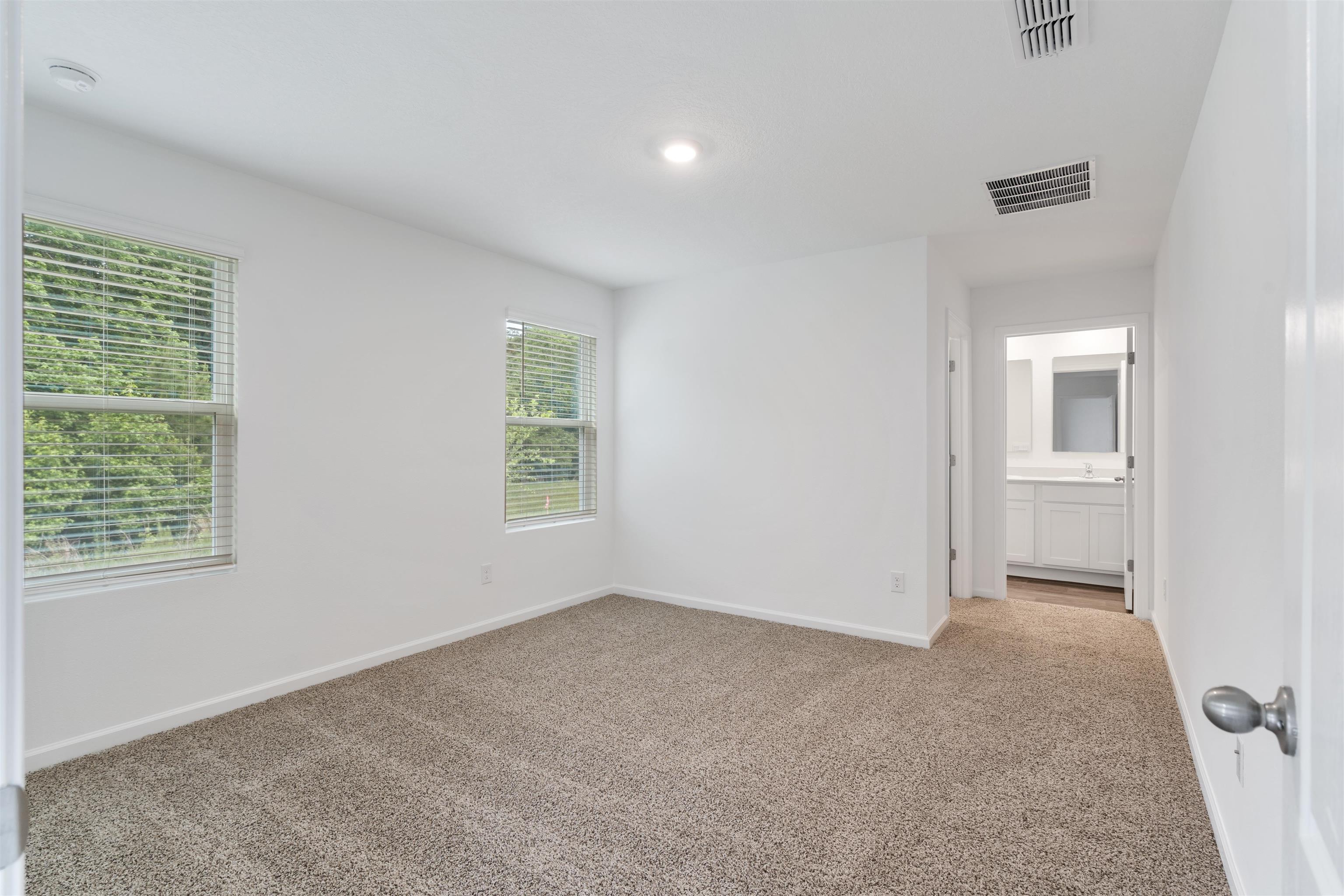 861 Orellana Road St. Augustine, FL 32084 - Photo 9 of 40 an empty room with windows