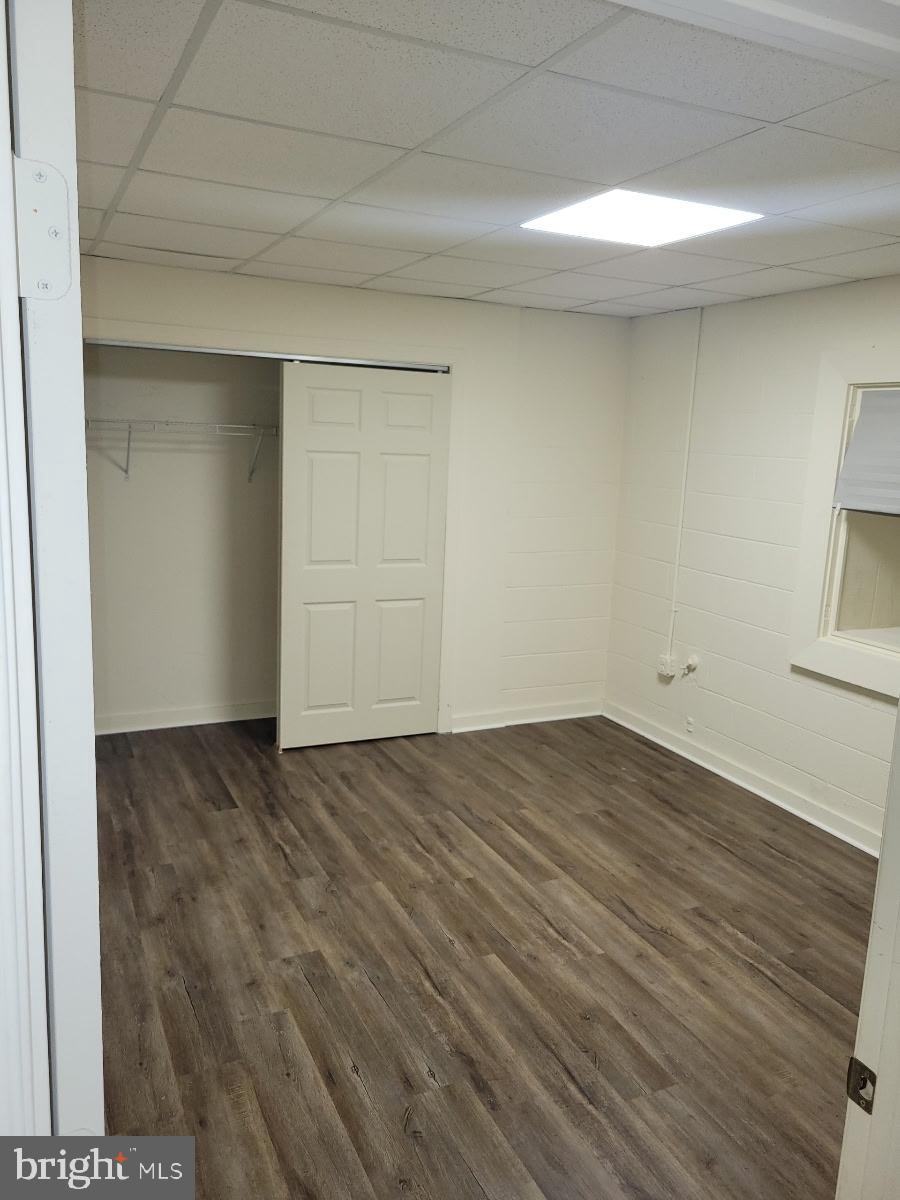 138 Harryhogan Road, Unit 13 Callao, VA 22435 - Photo 4 of 5 Spacious room with modern flooring.