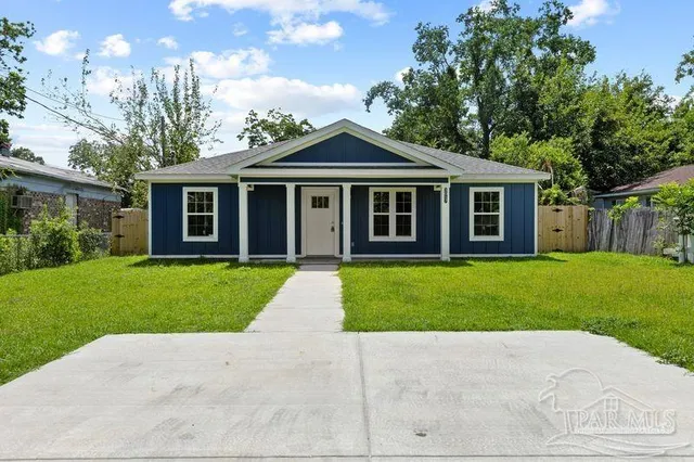front view of a house with a yard