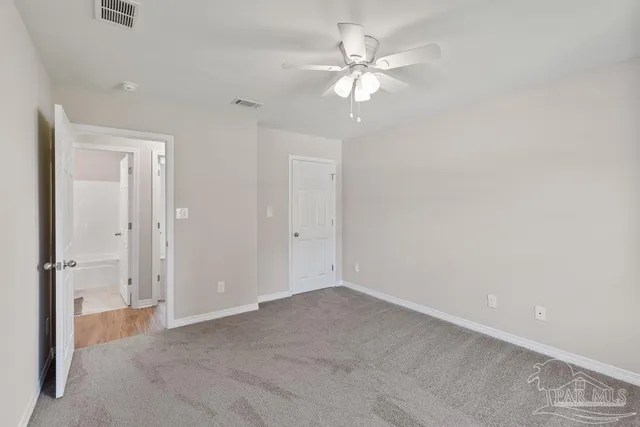 an empty room with a bathroom