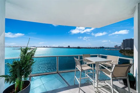 a view of a chairs and table in patio