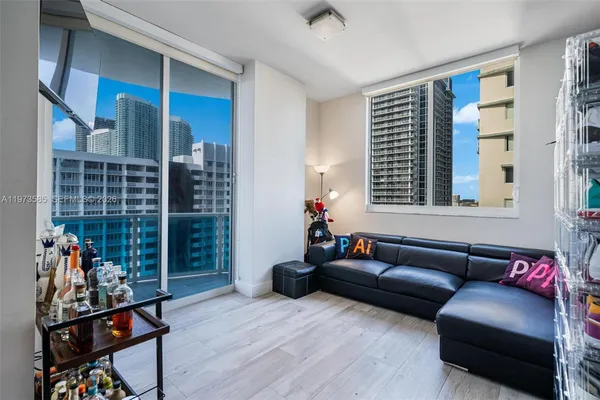 a living room with furniture and a window