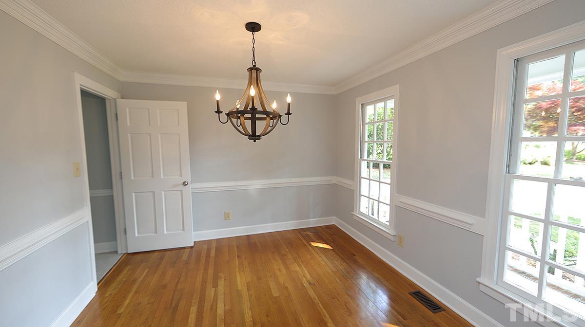 4505 Fortingale Circle Raleigh, NC 27613 - Photo 3 of 14 a view of a livingroom with a window and wooden floor