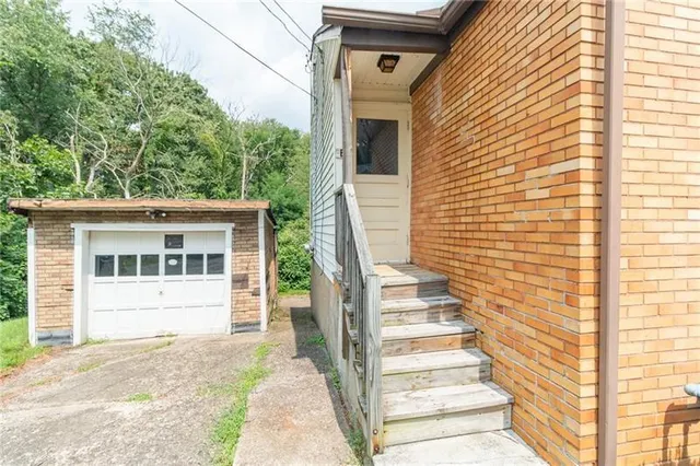 a front view of a house with a porch